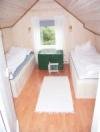 Eines der drei Schlafzimmer mit jeweils zwei Einzelbetten