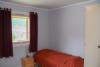 Eins der Schlafzimmer in Apartment 2