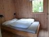 Das Schlafzimmer mit einem Doppelbett