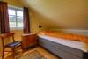 Eins der Schlafzimmer im OG